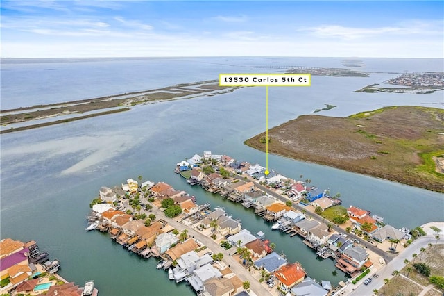 aerial view featuring a water view and a residential view