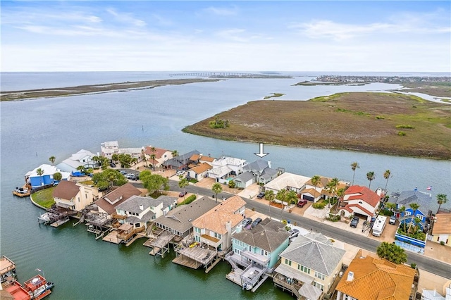 drone / aerial view featuring a residential view and a water view