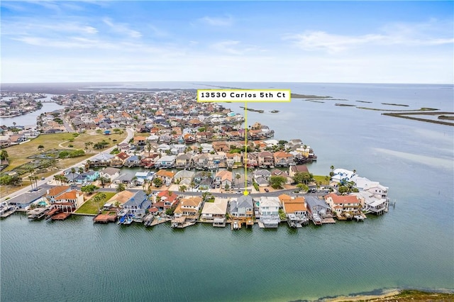 birds eye view of property featuring a water view and a residential view