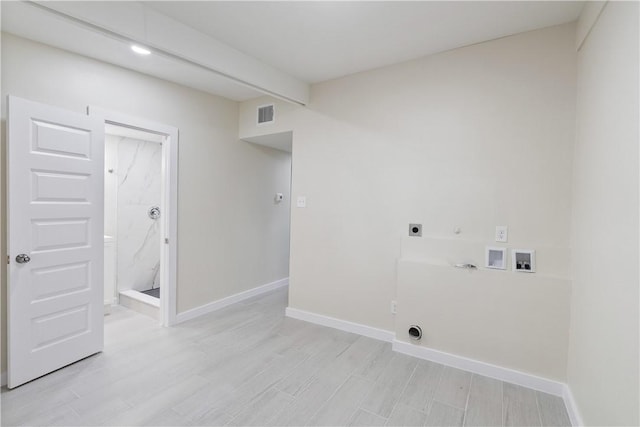 4938 Mable St, Corpus Christi, TX 78411 - laundry room featuring hookup for an electric dryer, hookup for a gas dryer, hookup for a washing machine, baseboards, and light wood-type flooring