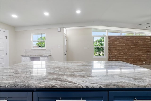 4938 Mable St, Corpus Christi, TX 78411 - kitchen with light stone countertops, blue cabinets, and recessed lighting