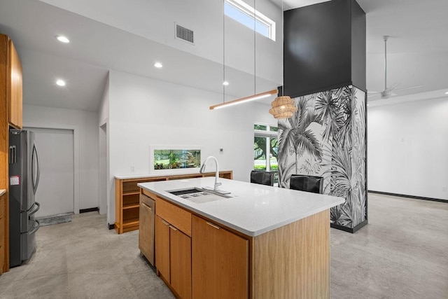 110 Forest Hls, Rockport, TX 78382 - kitchen with a sink, stainless steel appliances, concrete flooring, light countertops, and a towering ceiling