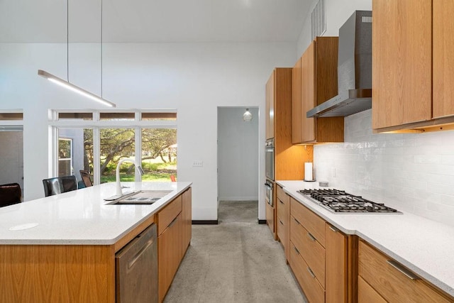110 Forest Hls, Rockport, TX 78382 - kitchen with a sink, wall chimney range hood, stainless steel appliances, and modern cabinets