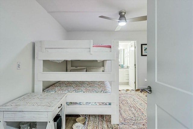 bedroom with ensuite bathroom and ceiling fan