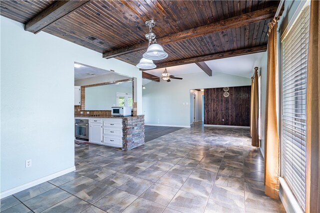 kitchen featuring lofted ceiling with beams, wood ceiling, white cabinets, oven, and ceiling fan