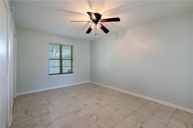 spare room featuring ceiling fan