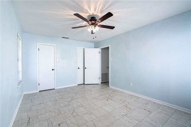 empty room featuring ceiling fan