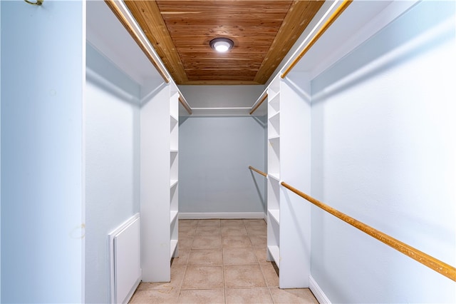 spacious closet featuring light tile patterned floors