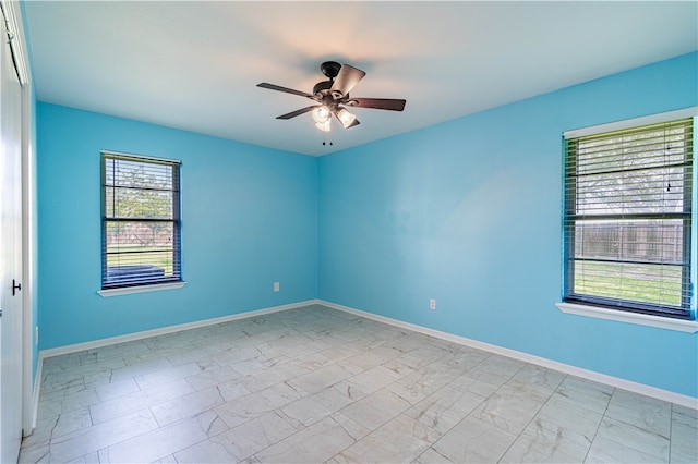 unfurnished room with ceiling fan