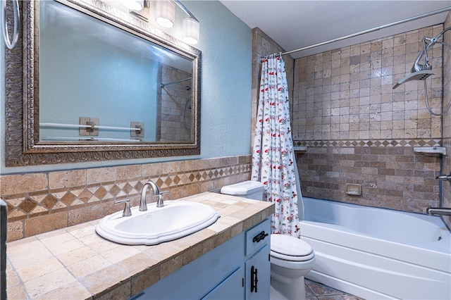 full bathroom with vanity, toilet, and shower / tub combo