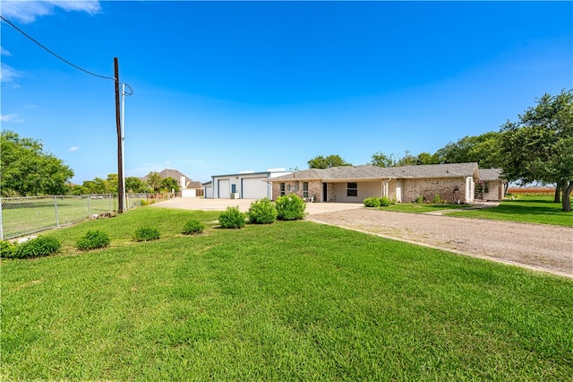 single story home with a garage and a front yard