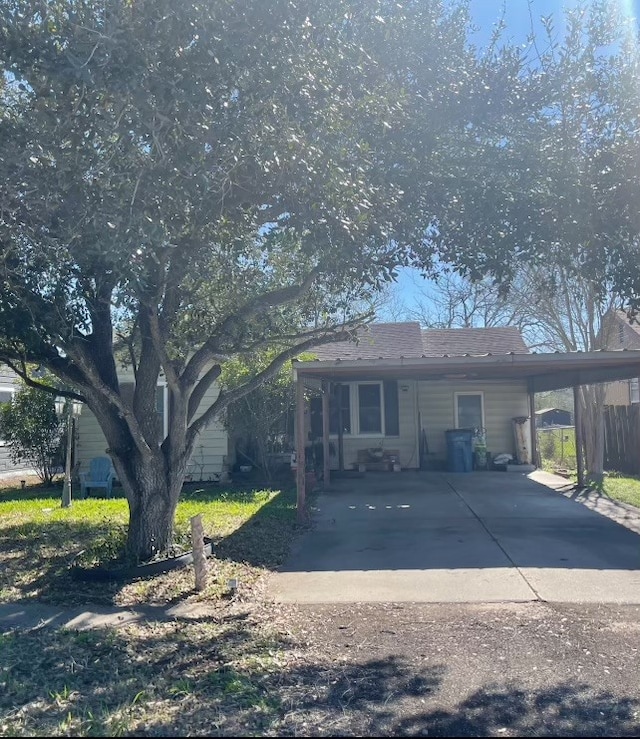 view of front of home with a carport