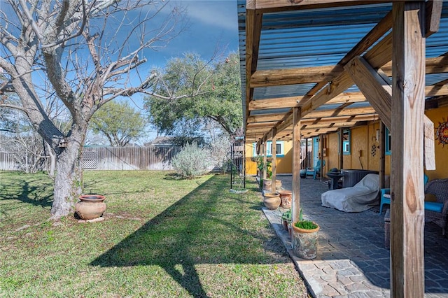 view of yard with a patio area and a fenced backyard