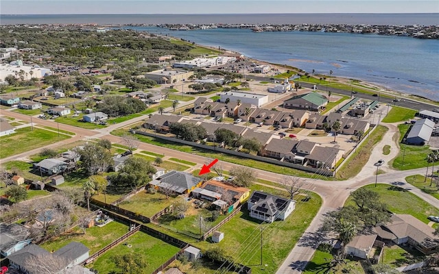 bird's eye view featuring a water view and a residential view