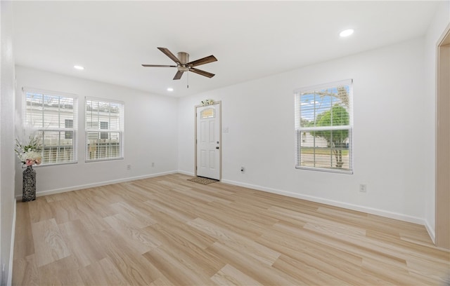 empty room featuring light wood-style floors, recessed lighting, ceiling fan, and baseboards