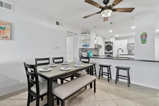 5973 State Highway 361 Unit 436, Port Aransas, TX 78373 - dining room with stacked washer / drying machine, ceiling fan, light tile patterned floors, and recessed lighting