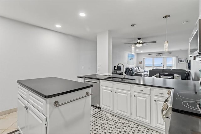 5973 State Highway 361 Unit 436, Port Aransas, TX 78373 - kitchen featuring stainless steel appliances, dark countertops, open floor plan, a ceiling fan, and recessed lighting