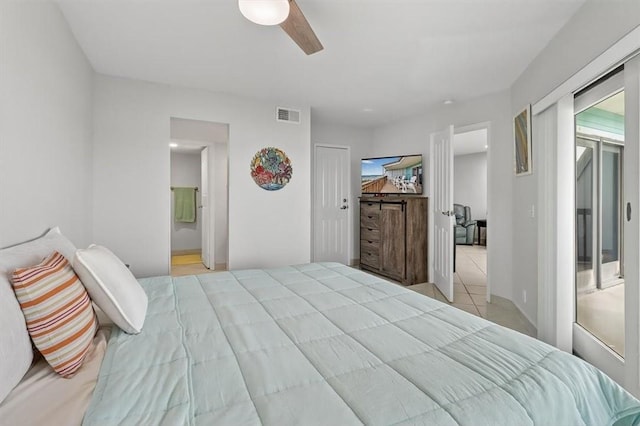 5973 State Highway 361 Unit 436, Port Aransas, TX 78373 - tiled bedroom featuring ceiling fan and ensuite bathroom