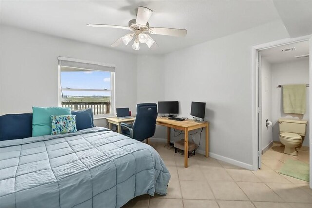 5973 State Highway 361 Unit 436, Port Aransas, TX 78373 - bedroom featuring light tile patterned floors, a ceiling fan, connected bathroom, and an office area