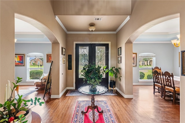 6001 King Trl, Corpus Christi, TX 78414 - foyer with hardwood / wood-style flooring, crown molding, and arched walkways