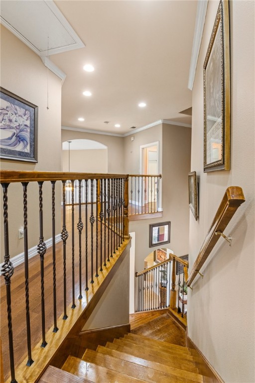 6001 King Trl, Corpus Christi, TX 78414 - stairs featuring attic access, crown molding, wood finished floors, and recessed lighting