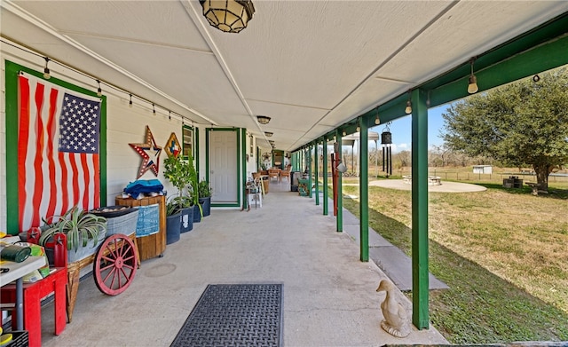 view of home's community with a patio area and a lawn