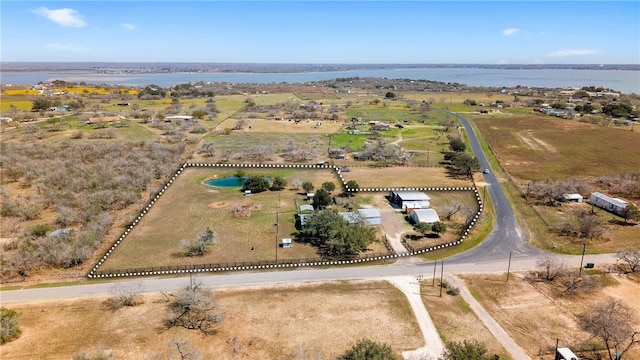 birds eye view of property with a rural view