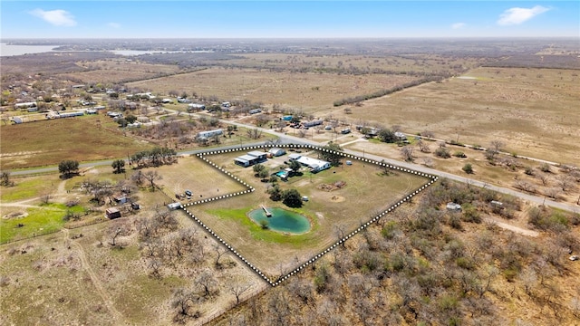 birds eye view of property featuring a rural view