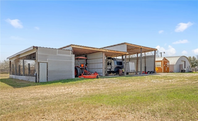 view of pole building with a yard