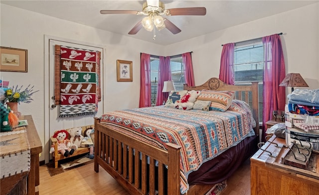 bedroom featuring ceiling fan and light wood-style flooring