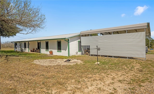 rear view of house with metal roof