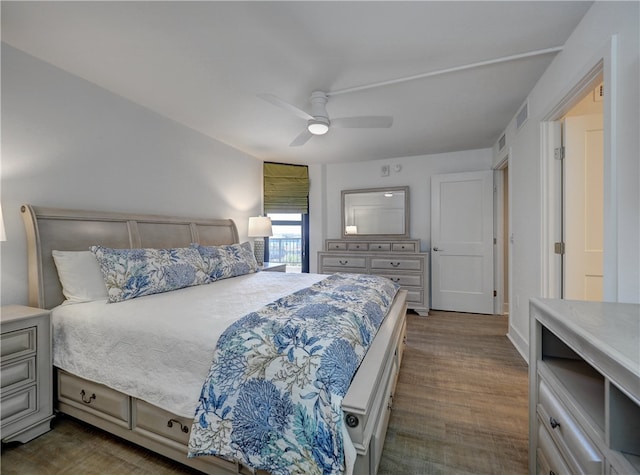 bedroom featuring ceiling fan and dark hardwood / wood-style flooring