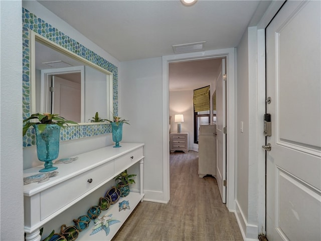 hallway featuring hardwood / wood-style floors