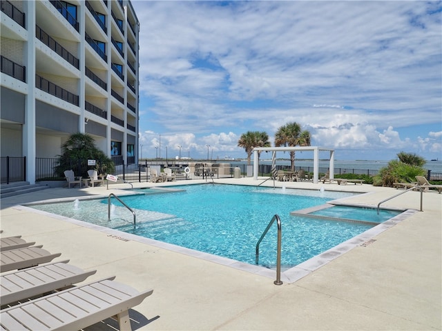 view of swimming pool with a patio area