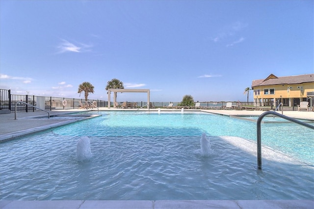 view of swimming pool featuring pool water feature