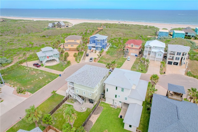 aerial view with a beach view and a water view