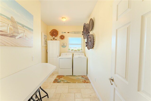 washroom featuring washer and clothes dryer