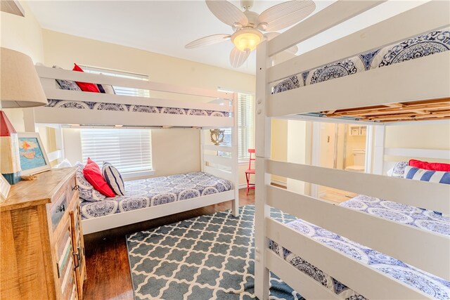 bedroom featuring dark wood-type flooring and ceiling fan