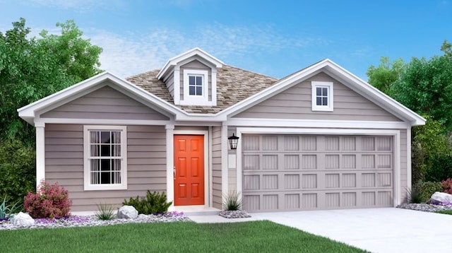 view of front of home featuring a garage and a front lawn