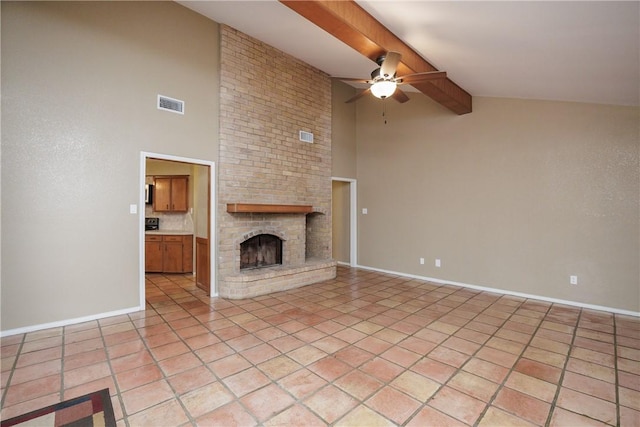 unfurnished living room featuring light tile patterned flooring, vaulted ceiling with beams, ceiling fan, and a fireplace