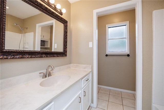 bathroom with vanity and tile patterned flooring