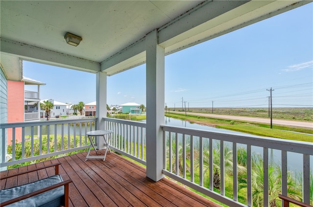 deck featuring a water view