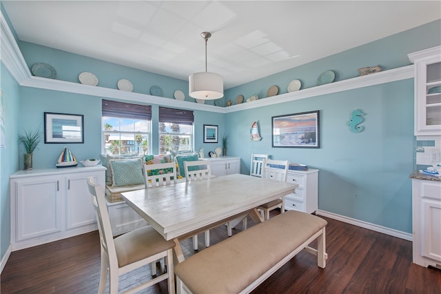 dining space with dark hardwood / wood-style floors