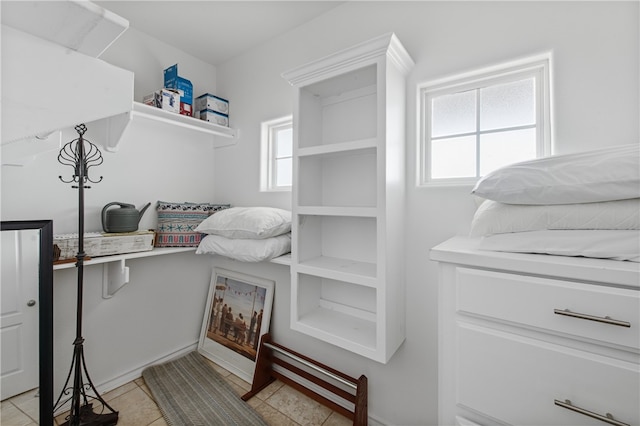 spacious closet featuring light tile patterned floors