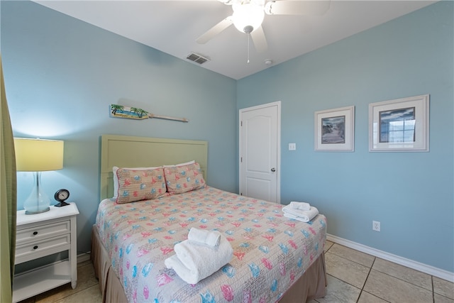 tiled bedroom with ceiling fan