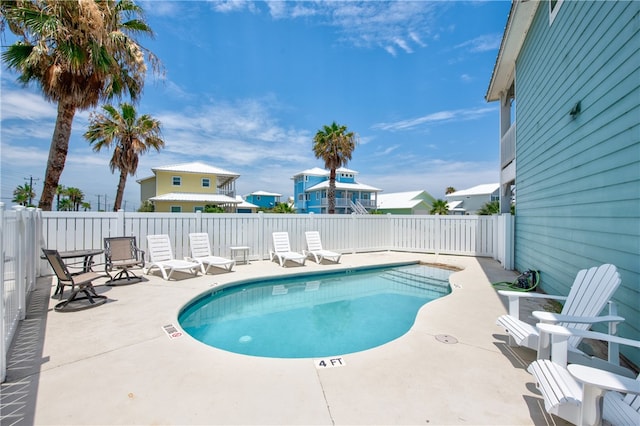 view of swimming pool with a patio area