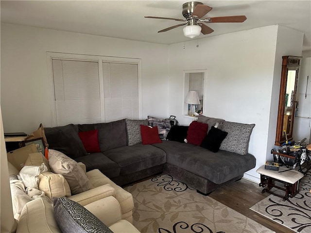 living room featuring ceiling fan and wood-type flooring