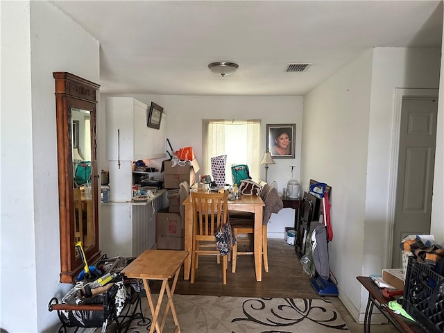 dining area with hardwood / wood-style flooring