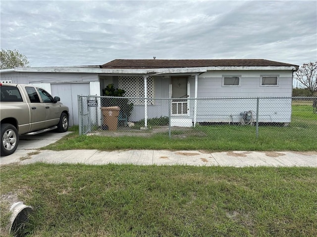 ranch-style house with a front lawn