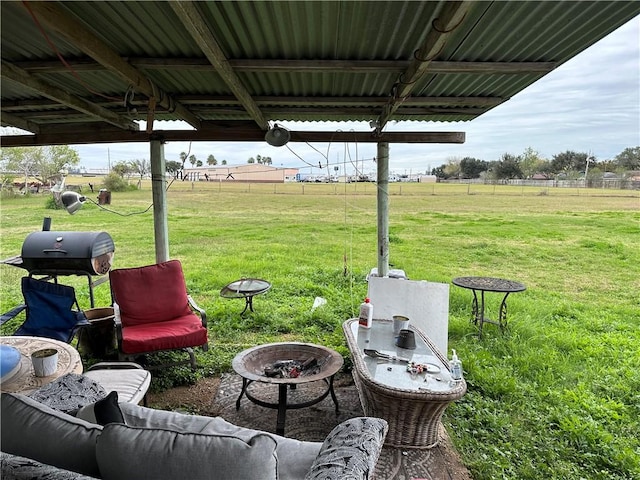 view of patio / terrace featuring a rural view and a fire pit